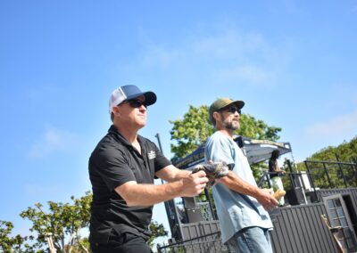 two men playing cornhole