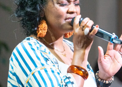 woman singing into a mic